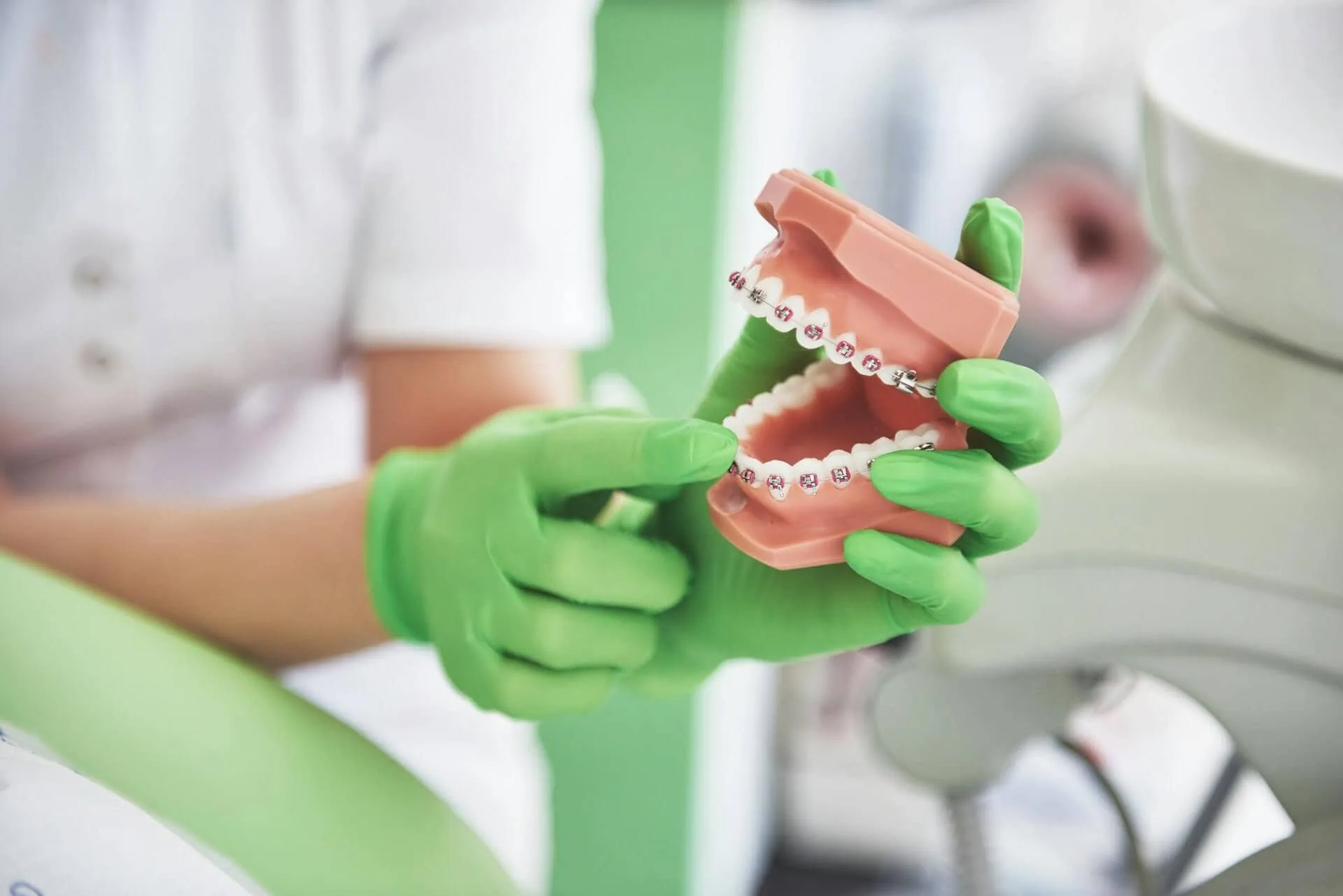 A person holding a set of teeth