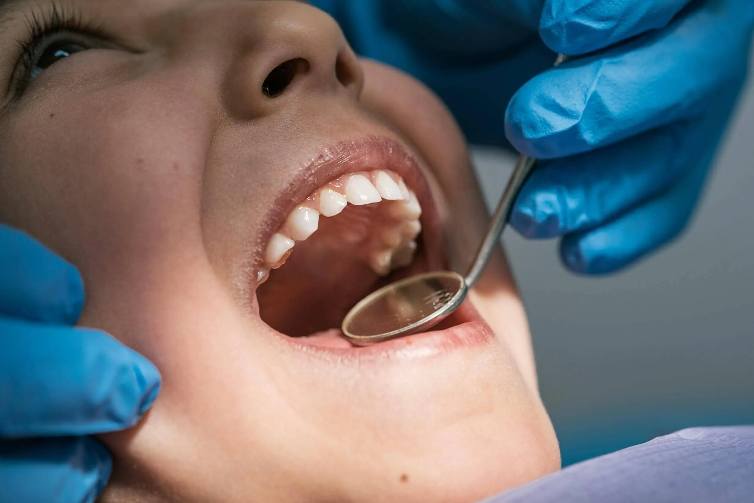 A woman getting her teeth checked