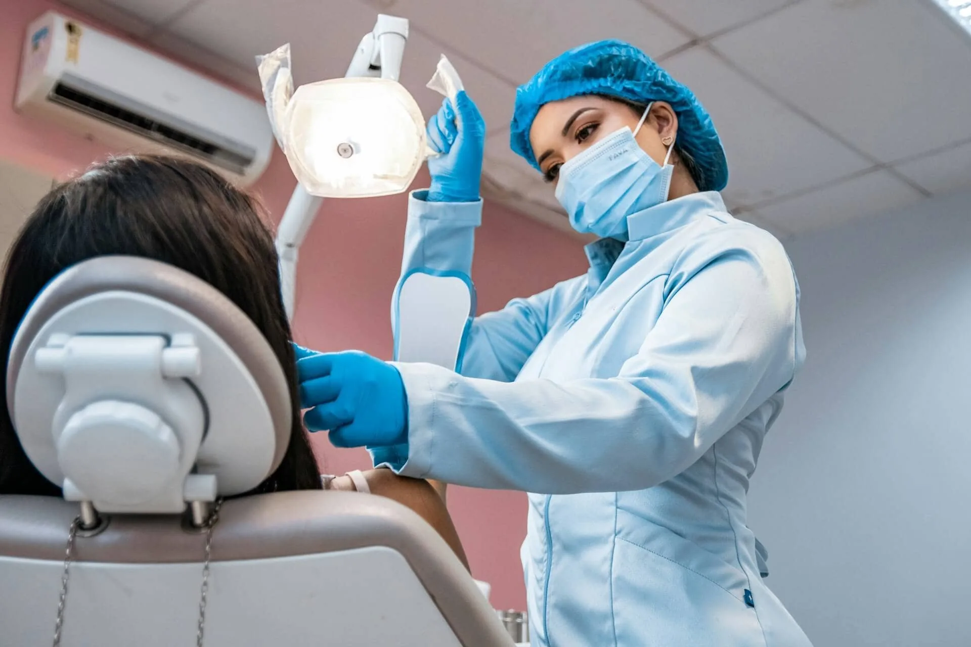 A dentist working on a patient