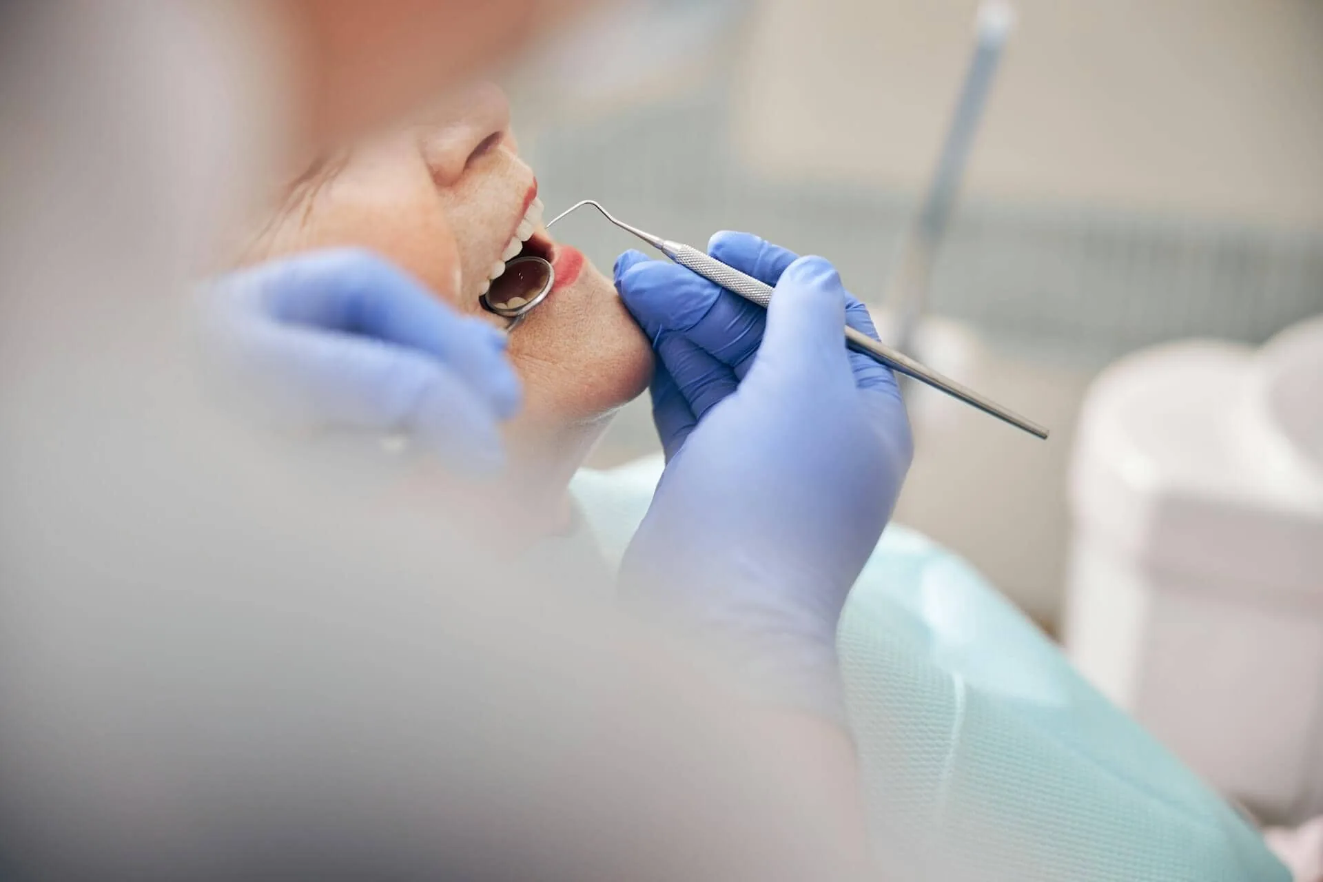 A dentist working on a patient