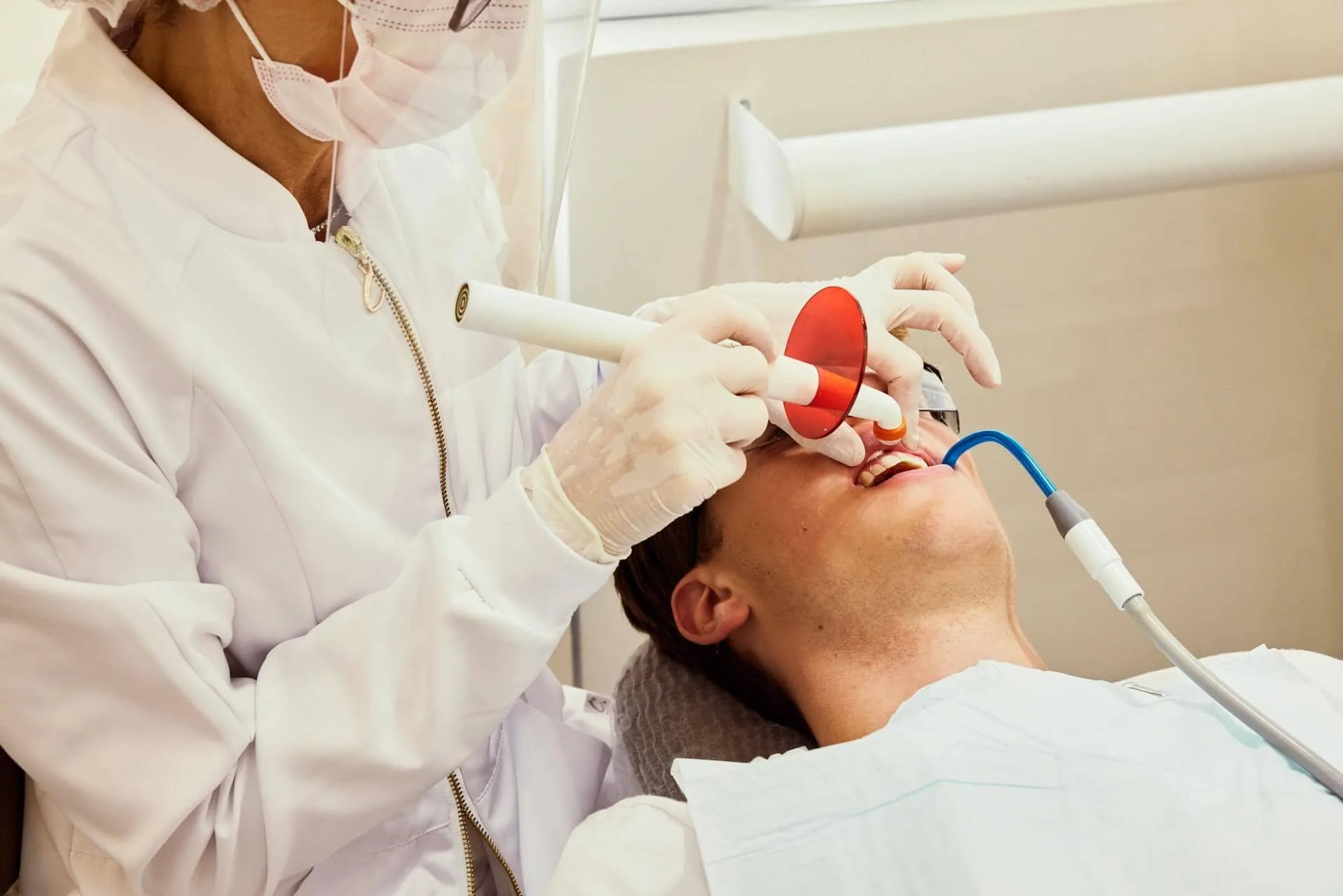 A dentist working on a patient