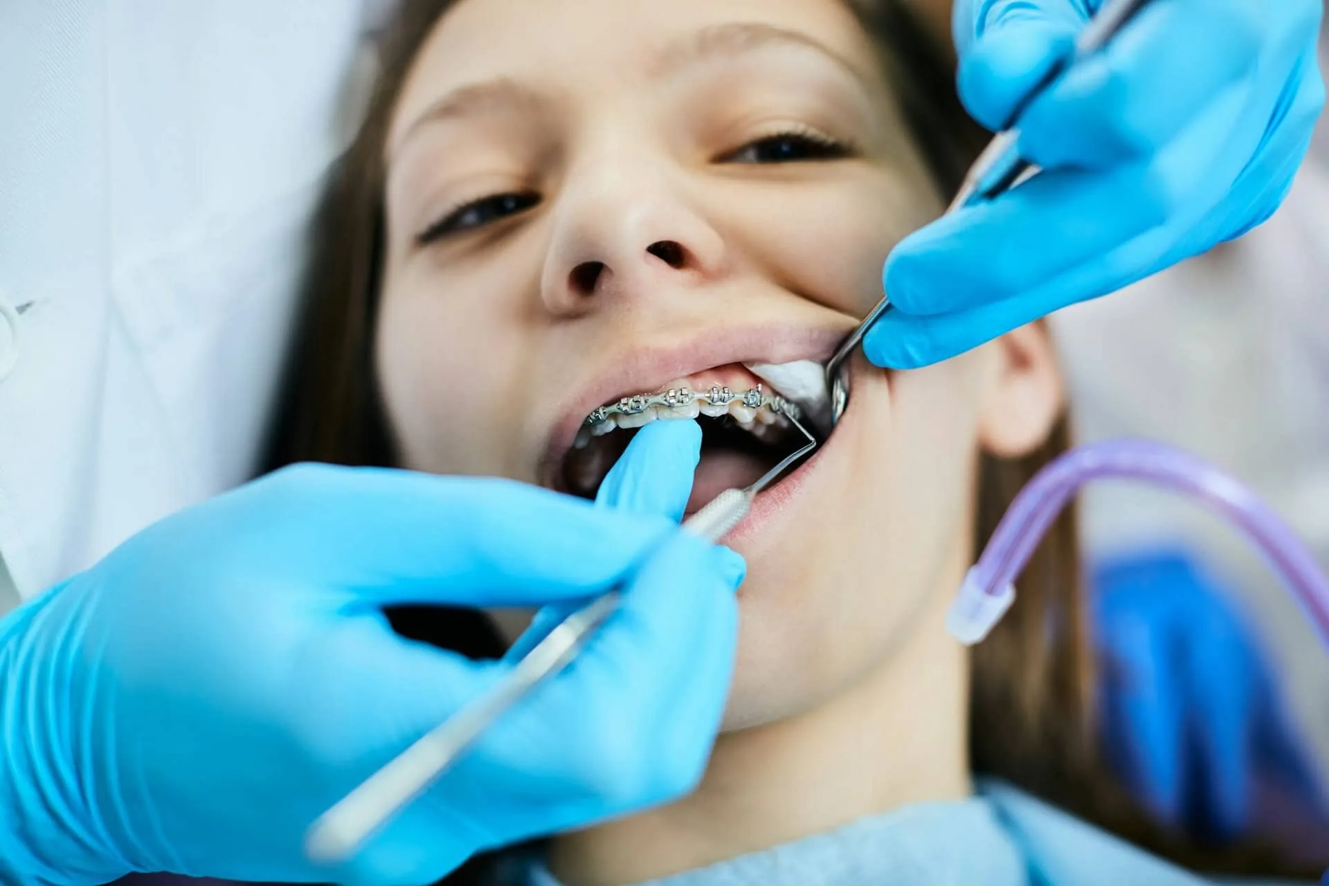 A girl getting her teeth checked
