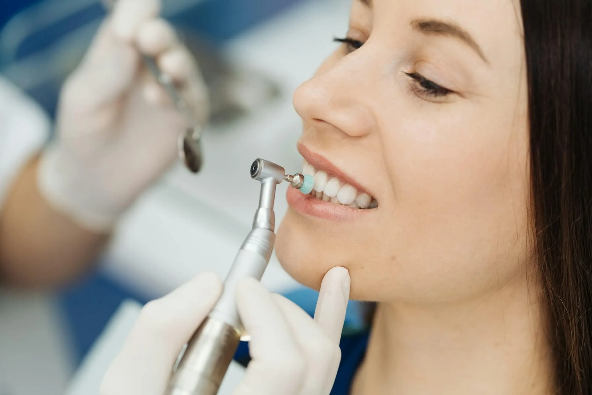 A woman being worked on by a dentist