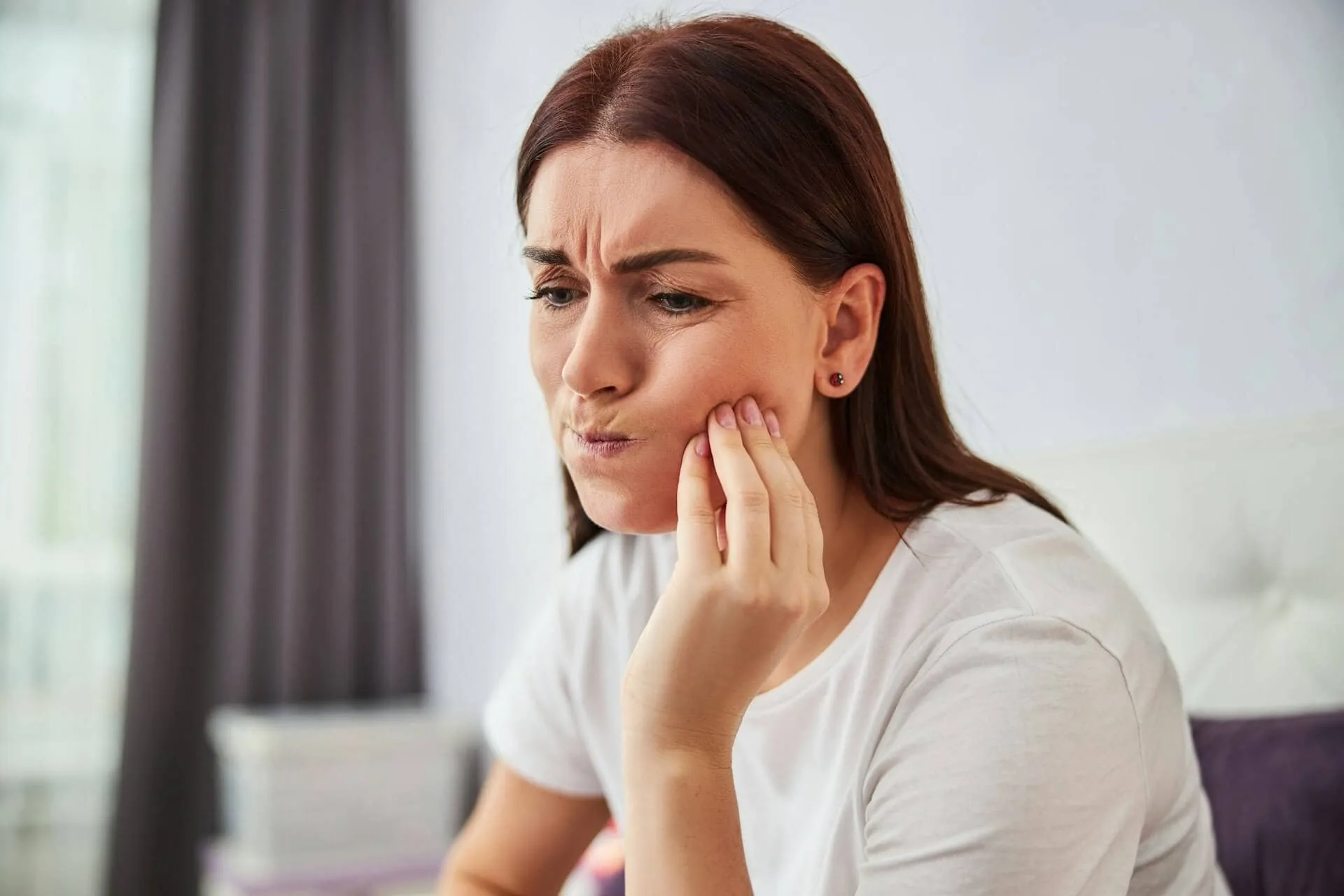 A woman having a tooth ache