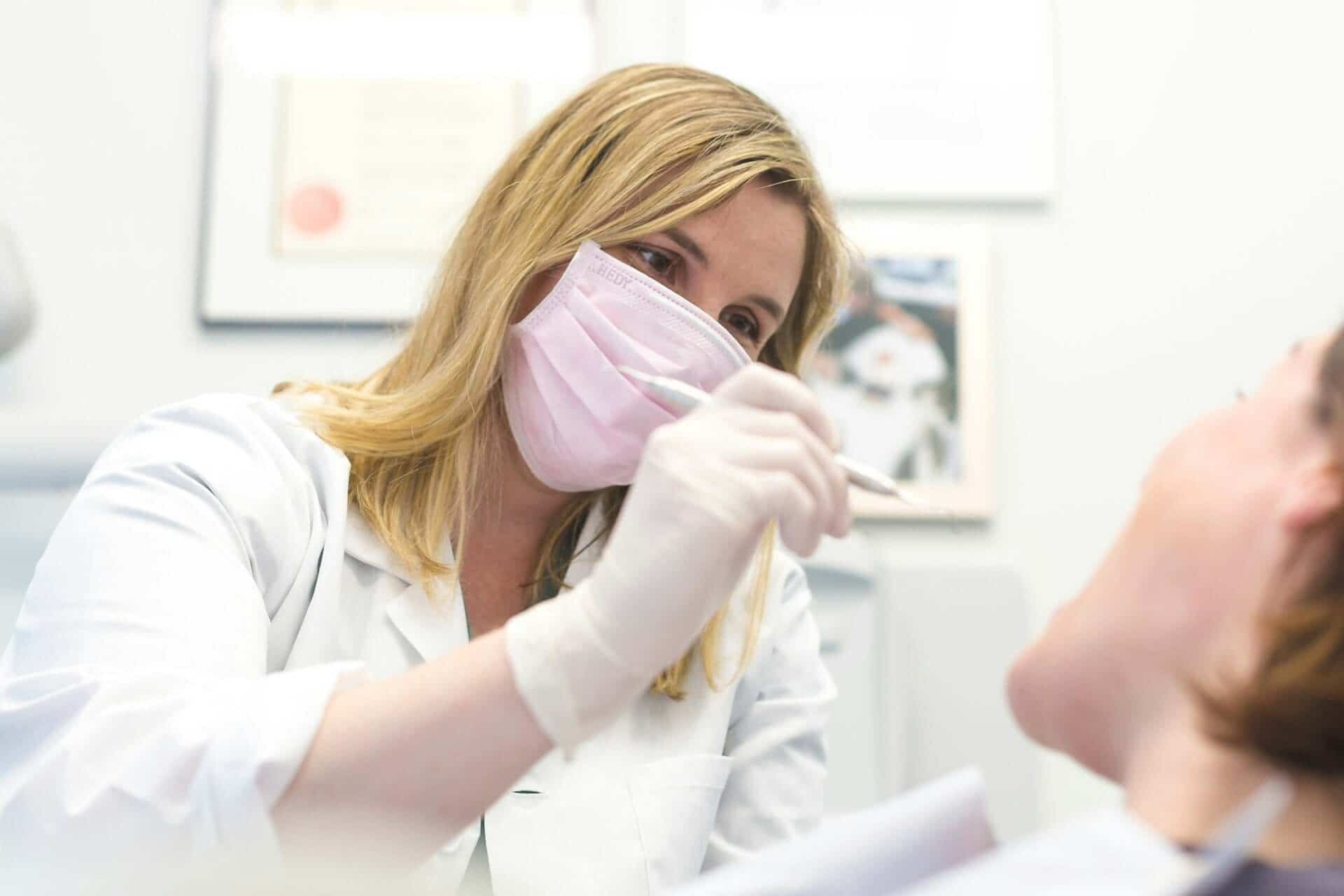 dentist consulting with a patient about periodontal treatment to help manage gum disease