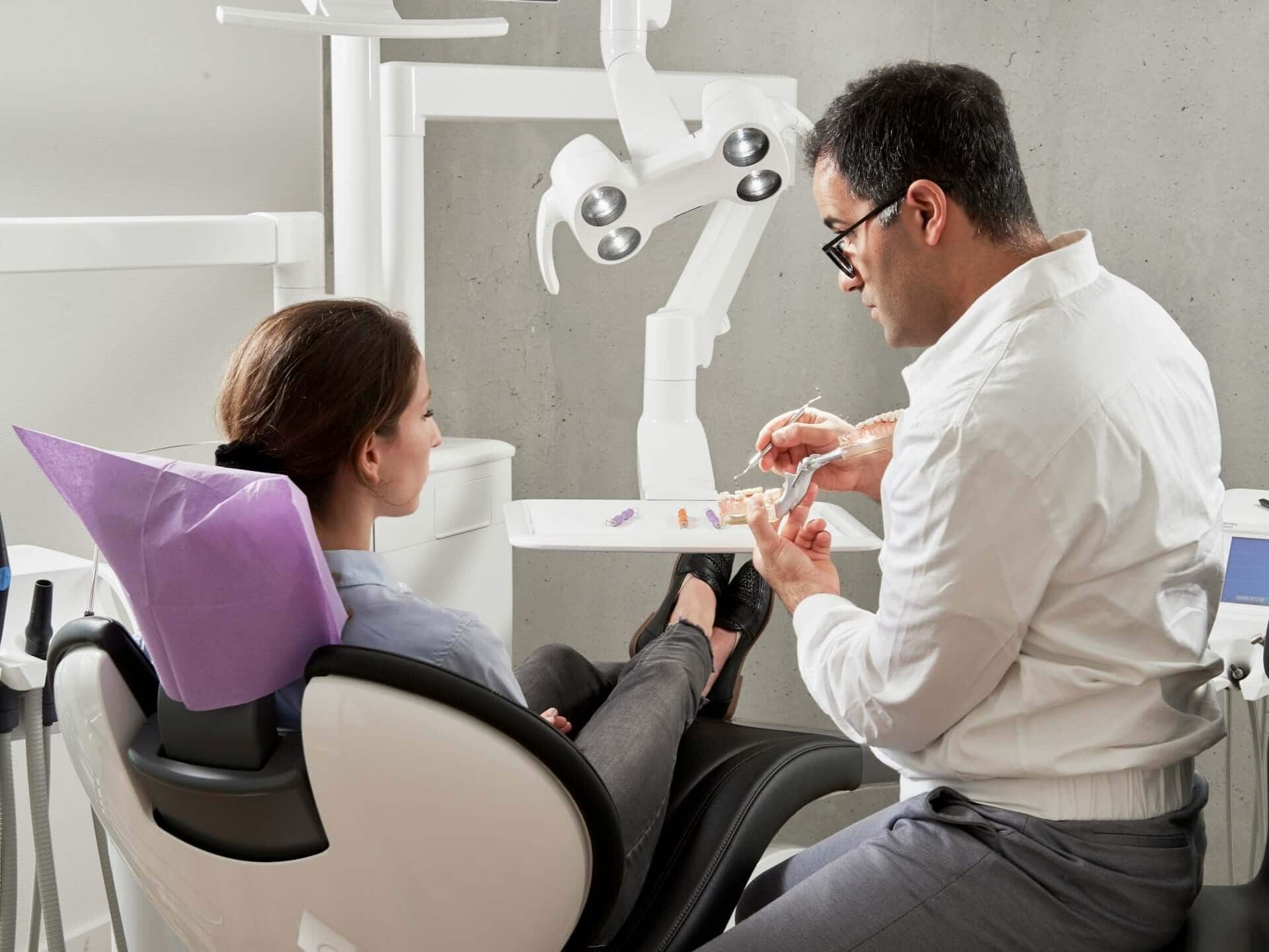 dentist discussing treatment options with a patient, highlighting how sedation dentistry can help reduce anxiety