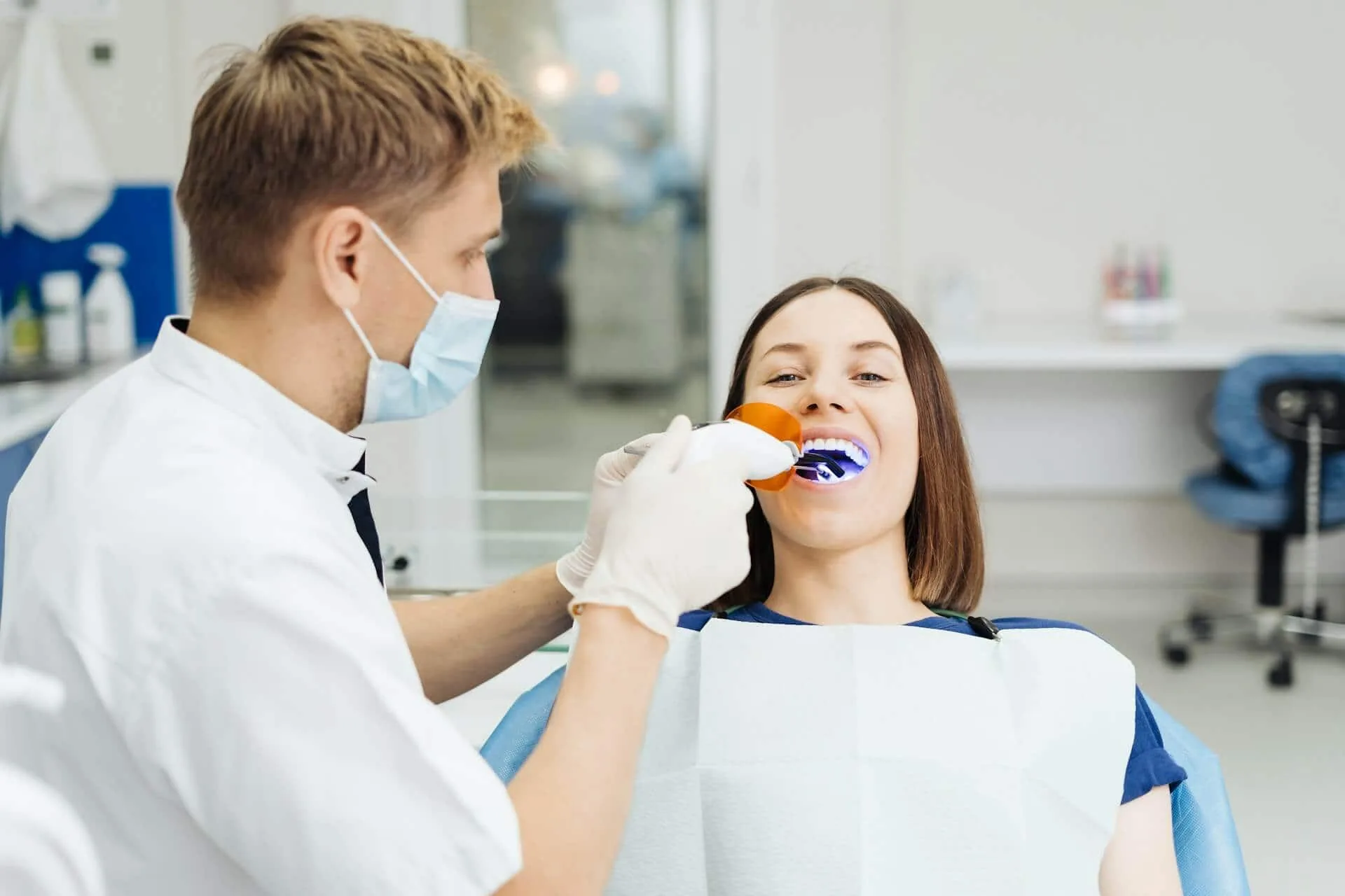 A woman being worked on by a dentist